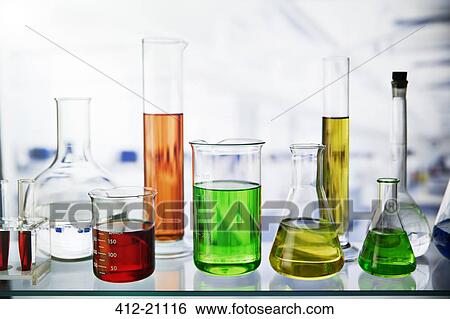 Beakers of various solutions on shelf in lab View Large Photo Image Stock Photograph - Beakers of various solutions on shelf in lab. Fotosearch