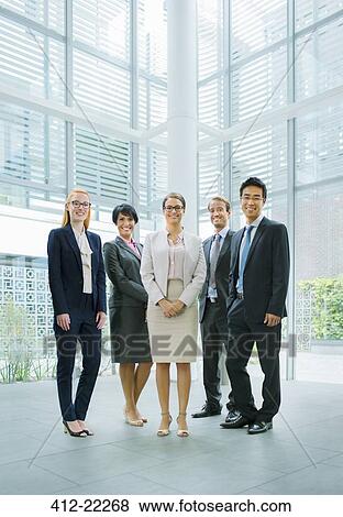 Business people gathered in office building View Large Photo Image Stock Photo - Business people gathered in office building. Fotosearch