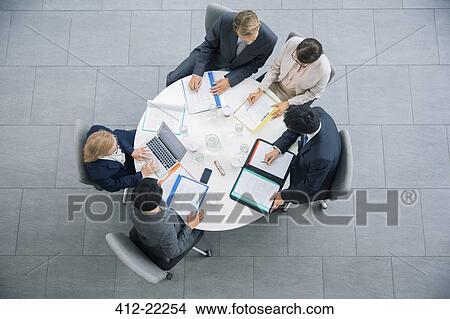 Business people having meeting at table View Large Photo Image Picture - Business people having meeting at table. Fotosearch
