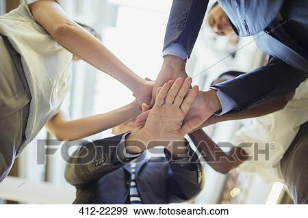 Business people putting hands together View Large Photo Image Stock Photo - Business people putting hands together . Fotosearch
