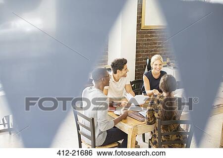 Business people talking at meeting in cafe View Large Photo Image Stock Photograph - Business people talking at meeting in cafe. Fotosearch