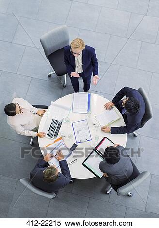 Business people talking in meeting at table View Large Photo Image Stock Photography - Business people talking in meeting at table. Fotosearch