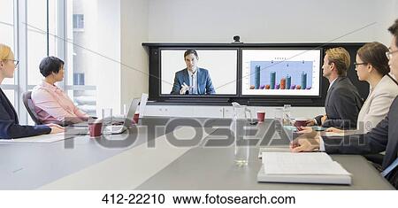 Business people using teleconference in meeting View Large Photo Image Stock Image - Business people using teleconference in meeting. Fotosearch