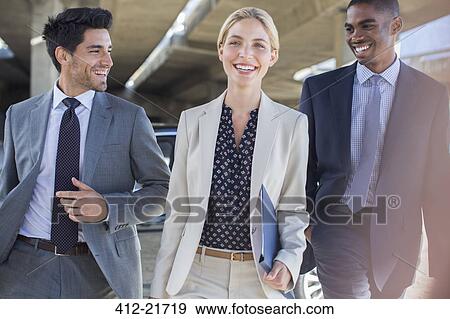 Business people walking together View Large Photo Image Stock Photo - Business people walking together. Fotosearch
