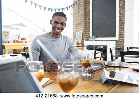 Businessman having lunch meeting in cafe View Large Photo Image Stock Photo - Businessman having lunch meeting in cafe. Fotosearch