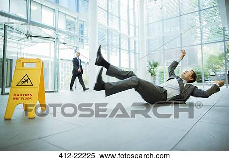 Businessman slipping on floor of office building View Large Photo Image Stock Photography - Businessman slipping on floor of office building. Fotosearch