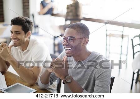 Businessmen at meeting in cafe View Large Photo Image Stock Photo - Businessmen at meeting in cafe. Fotosearch