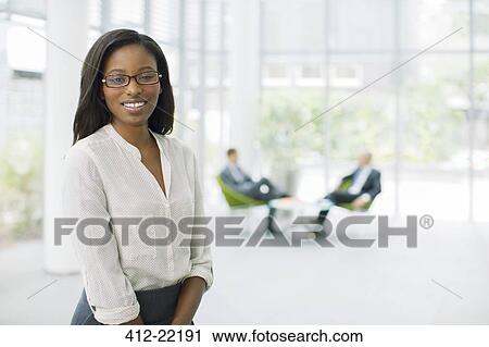 Businesswoman in office building View Large Photo Image Stock Image - Businesswoman in office building. Fotosearch