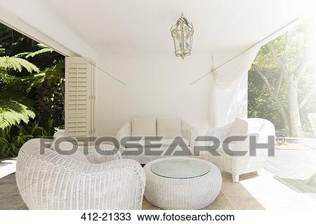 Cat sleeping in outdoor furniture on patio View Large Photo Image Stock Image - Cat sleeping in outdoor furniture on patio. Fotosearch