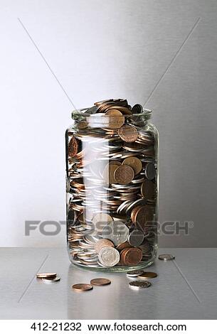 Change jar overflowing on counter View Large Photo Image Stock Image - Change jar overflowing on counter. Fotosearch