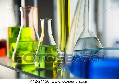 Close up of beakers with solutions on shelf in lab View Large Photo Image Stock Photograph - Close up of beakers with solutions on shelf in lab. Fotosearch