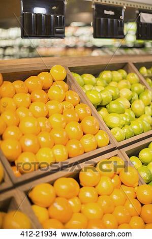 Picture - Close up of fruit for sale in produce section of grocery store. Fotosearch