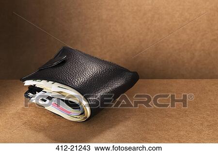 Close up of full wallet on counter View Large Photo Image Stock Image - Close up of full wallet on counter. Fotosearch