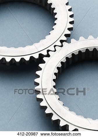 Close up of interlocking metal gears View Large Photo Image Stock Photo - Close up of interlocking metal gears. Fotosearch