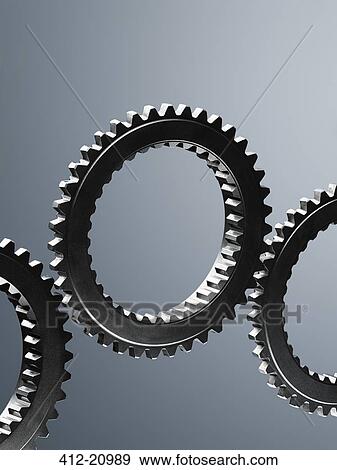 Close up of interlocking metal gears View Large Photo Image Stock Photo - Close up of interlocking metal gears. Fotosearch