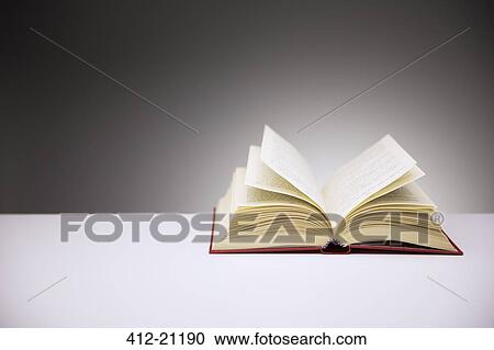 Close up of open book on counter View Large Photo Image Stock Image - Close up of open book on counter. Fotosearch