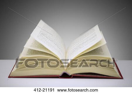 Close up of open book on counter View Large Photo Image Stock Image - Close up of open book on counter. Fotosearch