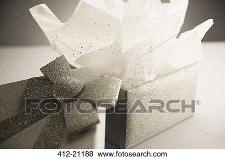 Close up of opened gift with tissue paper View Large Photo Image Stock Photo - Close up of opened gift with tissue paper. Fotosearch