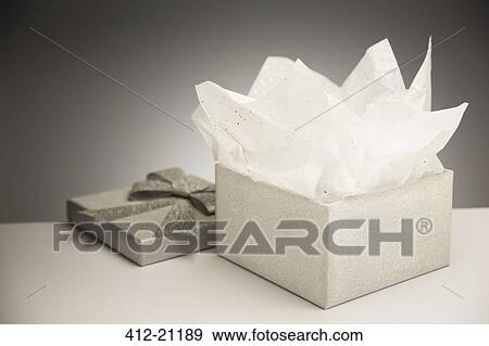 Close up of opened gift with tissue paper View Large Photo Image Stock Photo - Close up of opened gift with tissue paper. Fotosearch
