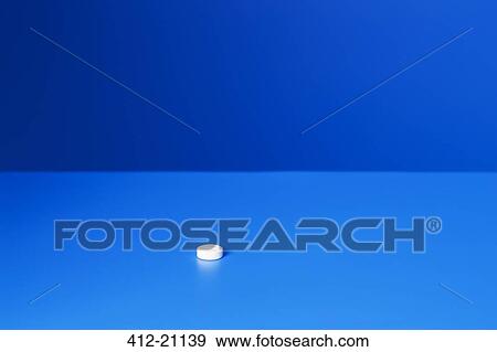 Close up of prescription pill on blue counter View Large Photo Image Stock Photo - Close up of prescription pill on blue counter. Fotosearch