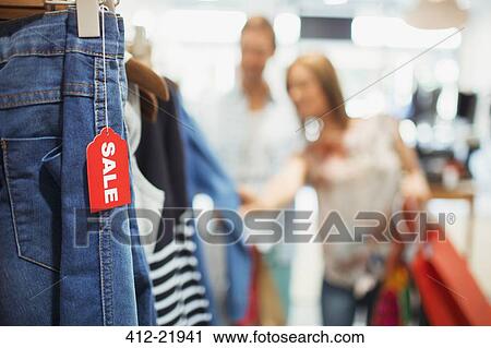 Stock Image - Close up of sale tag in clothing store. Fotosearch