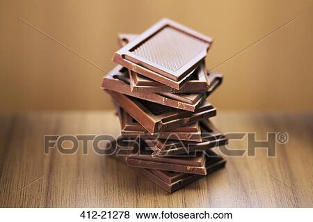 Close up of stack of chocolate squares View Large Photo Image Stock Photo - Close up of stack of chocolate squares. Fotosearch