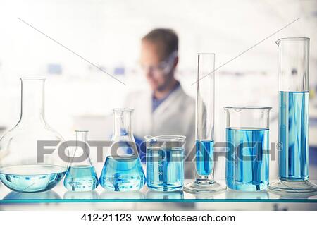 Close up of various solutions in beakers on shelf in lab View Large Photo Image Stock Image - Close up of various solutions in beakers on shelf in lab. Fotosearch