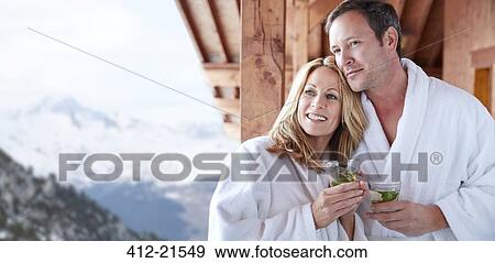 Couple in bathrobes standing on balcony together View Large Photo Image Stock Photo - Couple in bathrobes standing on balcony together. Fotosearch