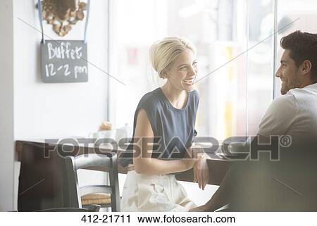 Couple talking in cafe View Large Photo Image Stock Image - Couple talking in cafe. Fotosearch