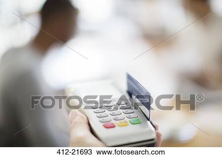 Credit card being swiped through payment machine View Large Photo Image Stock Image - Credit card being swiped through payment machine . Fotosearch