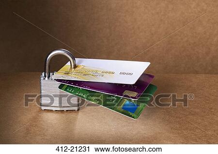 Stock Image - Credit cards attached to padlock. Fotosearch