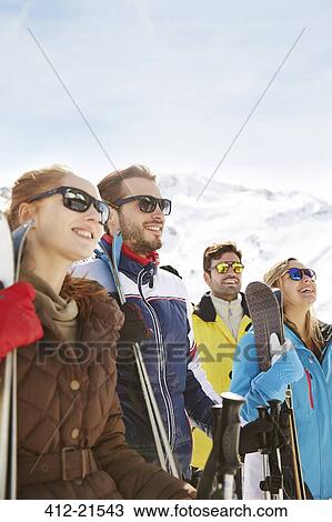 Friends admiring the snow together View Large Photo Image Stock Image - Friends admiring the snow together. Fotosearch