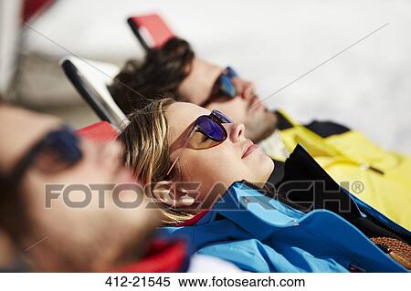 Stock Photography - Friends relaxing together. Fotosearch