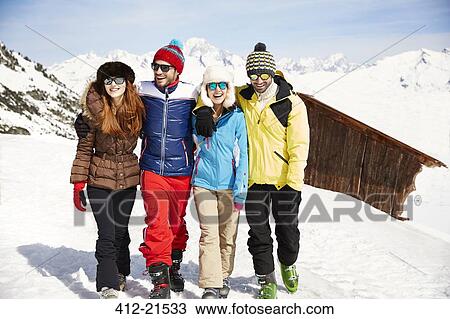 Friends walking in the snow together View Large Photo Image Stock Image - Friends walking in the snow together . Fotosearch