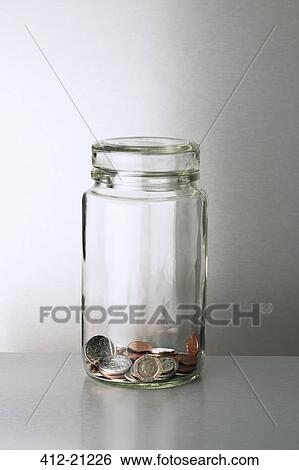 Glass change jar on counter View Large Photo Image Stock Photograph - Glass change jar on counter. Fotosearch