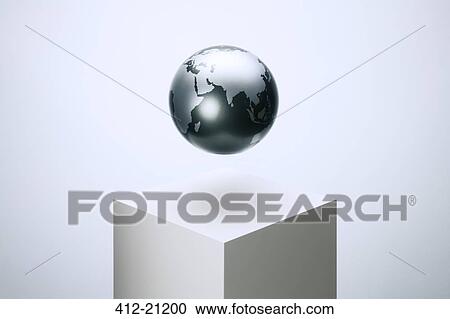 Stock Image - Globe hovering over pedestal. Fotosearch