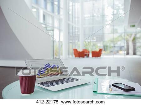 Stock Photography - laptop on work desk in office building. Fotosearch