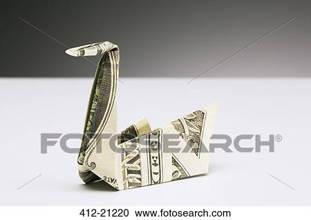 Origami swan made of dollar bill on counter View Large Photo Image Stock Image - Origami swan made of dollar bill on counter. Fotosearch