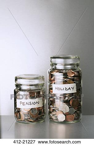Pension and holiday change savings jars on counter View Large Photo Image Stock Photo - Pension and holiday change savings jars on counter. Fotosearch