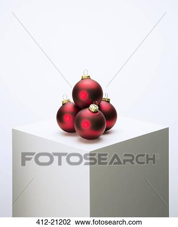 Pile of Christmas ornaments on pedestal View Large Photo Image Stock Image - Pile of Christmas ornaments on pedestal. Fotosearch