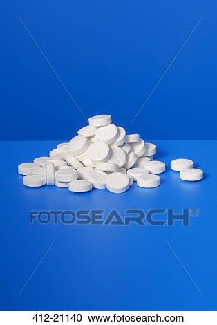 Pile of prescription pills on blue counter View Large Photo Image Stock Image - Pile of prescription pills on blue counter. Fotosearch