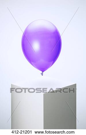 Purple balloon hovering over pedestal View Large Photo Image Stock Image - Purple balloon hovering over pedestal. Fotosearch