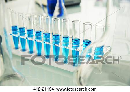 Rack of test tubes with solution on counter in lab View Large Photo Image Picture - Rack of test tubes with solution on counter in lab. Fotosearch