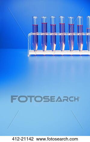 Rack of test tubes with solution on blue counter View Large Photo Image Stock Image - Rack of test tubes with solution on blue counter. Fotosearch
