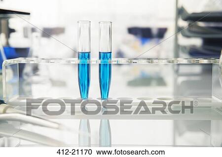 Rack of test tubes with solution on counter in lab View Large Photo Image Stock Image - Rack of test tubes with solution on counter in lab. Fotosearch