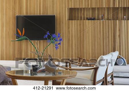Stock Image - Side table, armchairs and television in modern living room. Fotosearch
