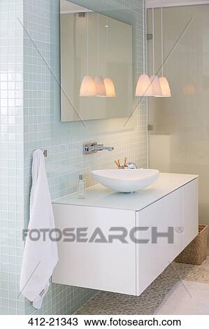 Sink, mirror and lamps in modern bathroom View Large Photo Image Stock Image - Sink, mirror and lamps in modern bathroom. Fotosearch