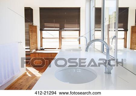 Sinks, counter, and mirrors in modern bathroom View Large Photo Image Picture - Sinks, counter, and mirrors in modern bathroom. Fotosearch
