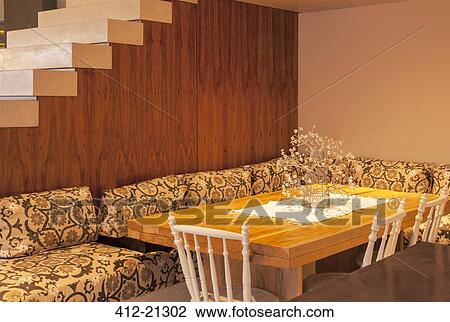 Sofa surrounding dining room table in modern house View Large Photo Image Stock Image - Sofa surrounding dining room table in modern house. Fotosearch