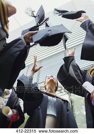 Students in gowns throwing caps in the air View Large Photo Image Stock Photography - Students in gowns throwing caps in the air. Fotosearch